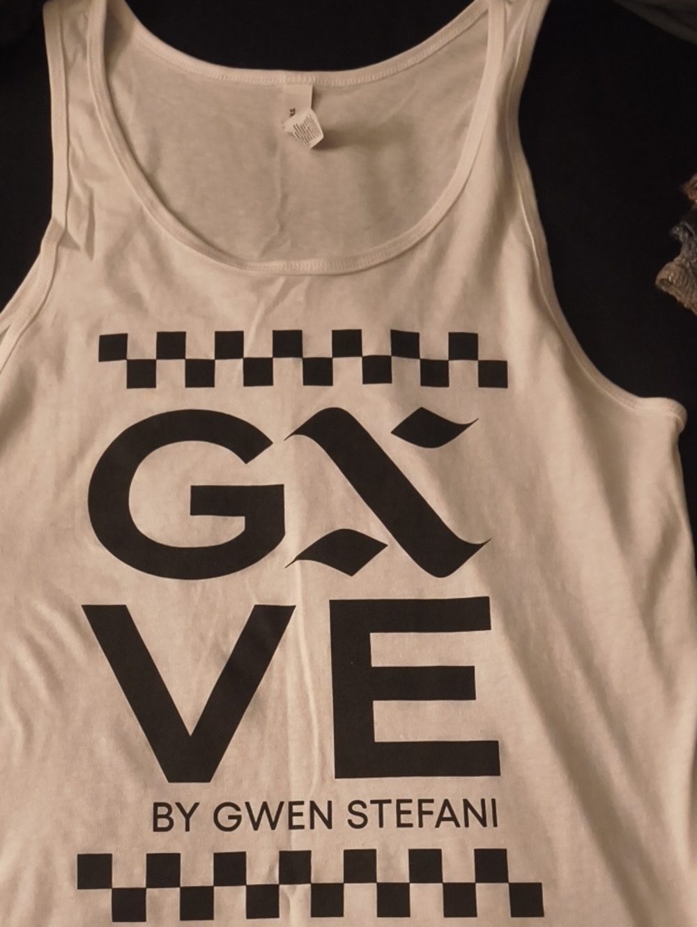 Bella Canvas White Tank Top with Black Graphic "GIVE by Gwen Stefani"